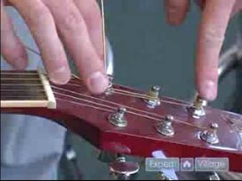 Tips on How to Set Up a Guitar : How to Replace Strings on an Acoustic Guitar