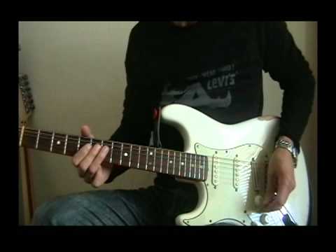 Left handed guitarist playing both left and right handed guitars